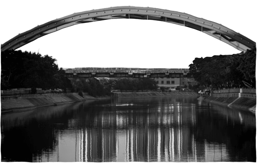 An arched bridge reflected in the water